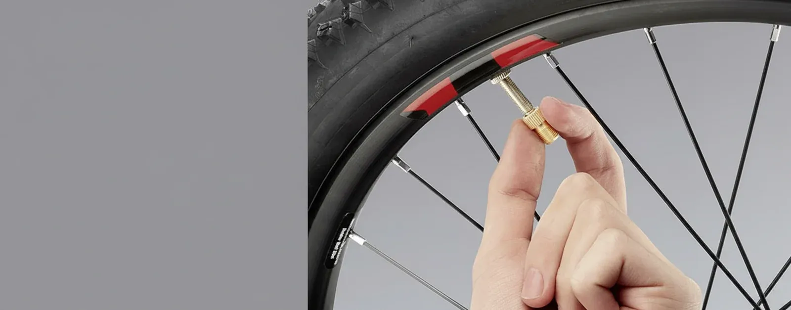 Portable tyre inflator being used by a driver for roadside maintenance