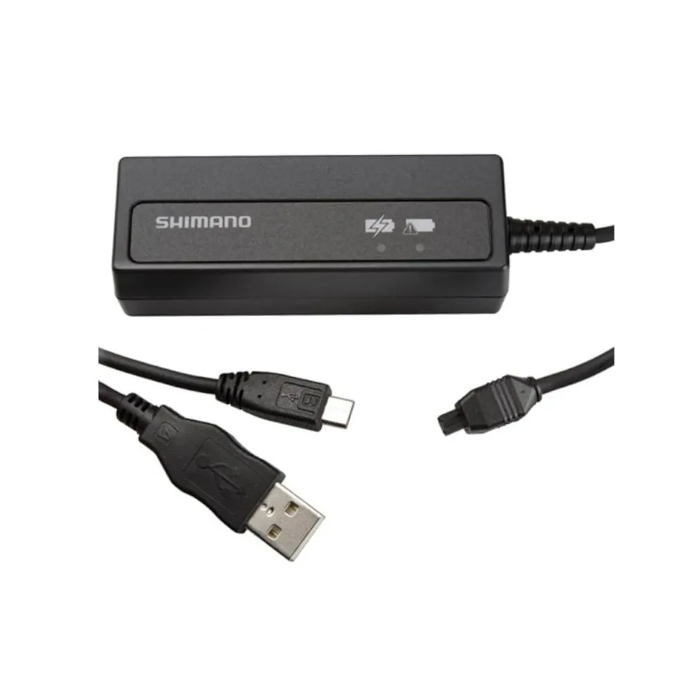 Shimano Di2 internal bike battery charger shown as a black compact unit with USB lead and connector detail on a white background