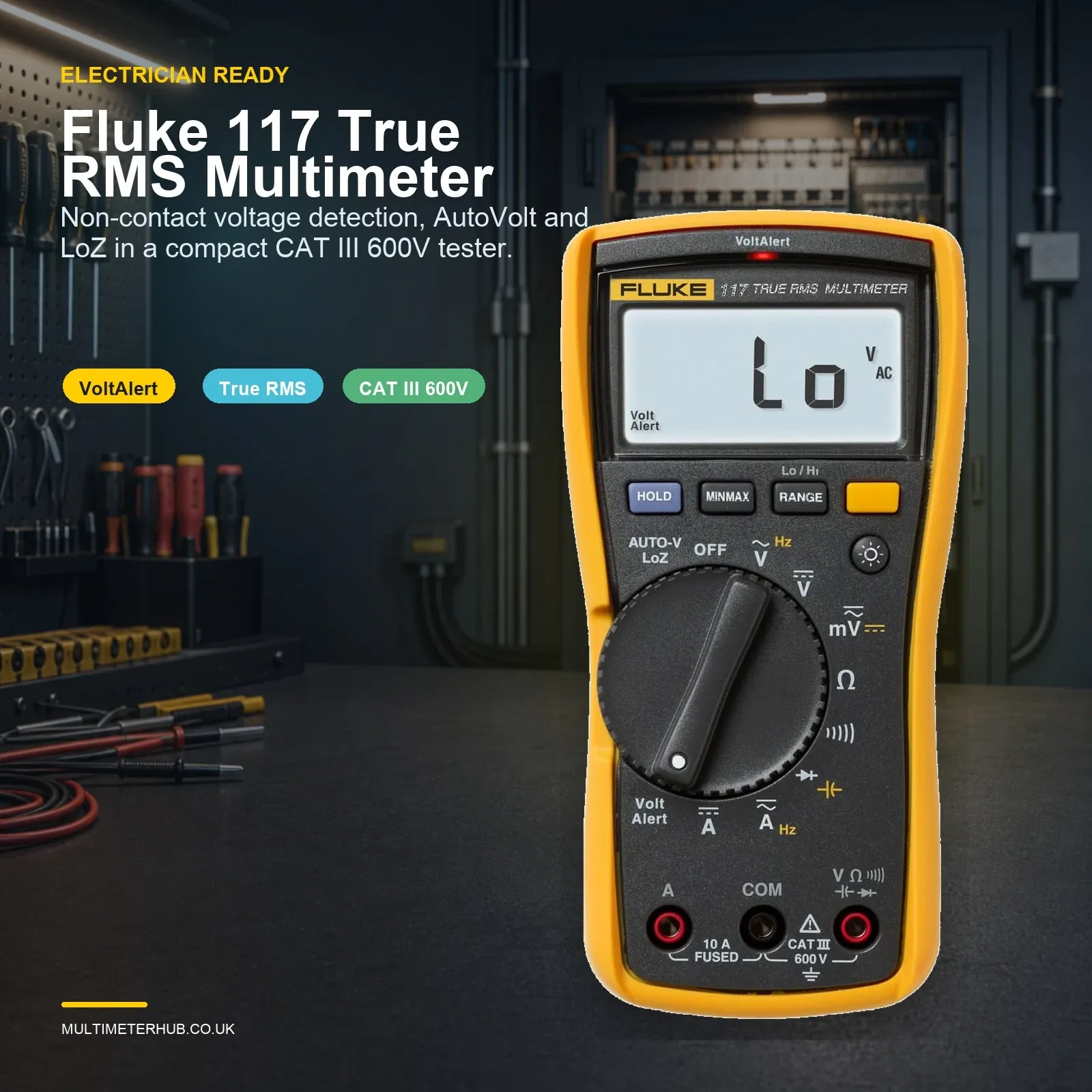 Fluke 117 True RMS digital multimeter shown front-facing in a workshop-style electrical setting, with active display, probe leads visible and features highlighted for volt alert, true RMS and CAT III 600V use.