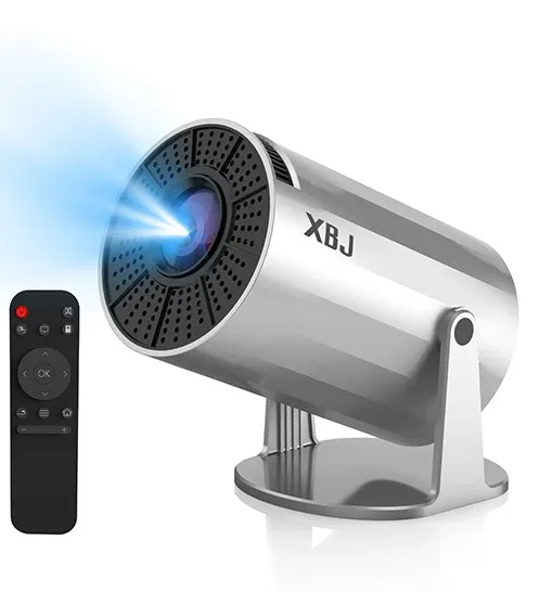 Silver compact wireless projector with remote control, shown on a white background with a projected blue beam.